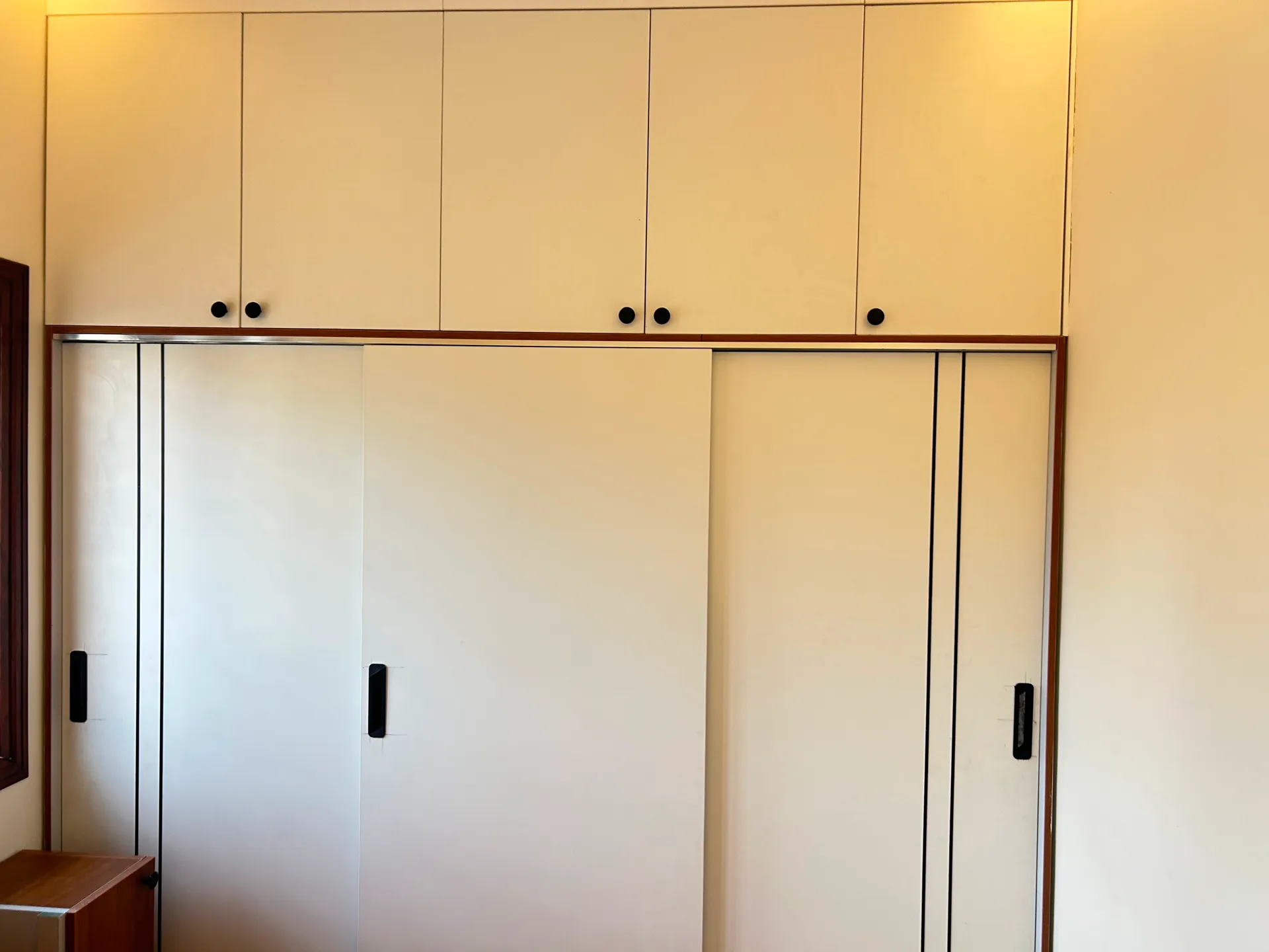 Sliding wardrobe with loft storage and ambient lighting — completed Elvenwood project in Bangalore
